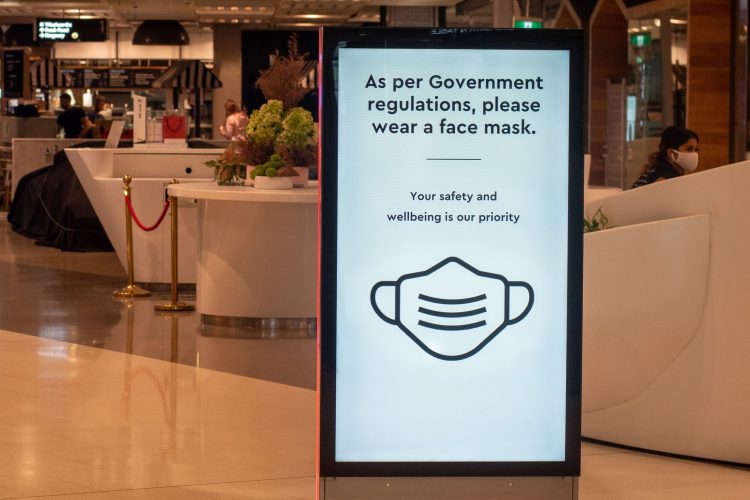 Sydney, Australia - 2020-01-14 Wearing face masks in shopping centres are compulsory in some australian states. As per Government regulations, please wear a face mask